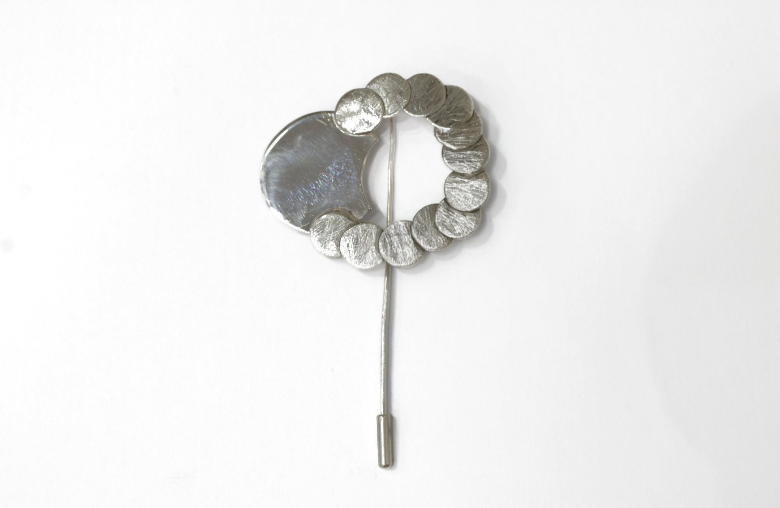 Brooch and motion